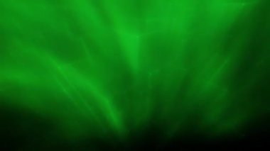 Soyut hareket arkaplanı renkli parçacıklar parlıyor. Kusursuz 4K döngü videosu.