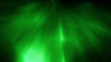 Soyut hareket arkaplanı renkli parçacıklar parlıyor. Kusursuz 4K döngü videosu.