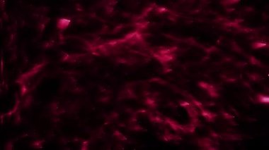 Soyut hareket arkaplanı renkli parçacıklar parlıyor. Kusursuz 4K döngü videosu.