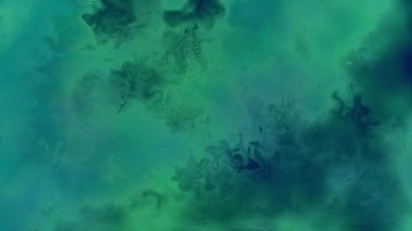 Soyut hareket arkaplanı renkli parçacıklar parlıyor. Kusursuz 4K döngü videosu.