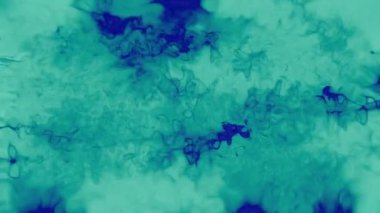 Soyut hareket arkaplanı renkli parçacıklar parlıyor. Kusursuz 4K döngü videosu.