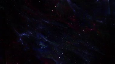 Soyut hareket arkaplanı renkli parçacıklar parlıyor. Kusursuz 4K döngü videosu.