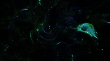 Soyut hareket arkaplanı renkli parçacıklar parlıyor. Kusursuz 4K döngü videosu.