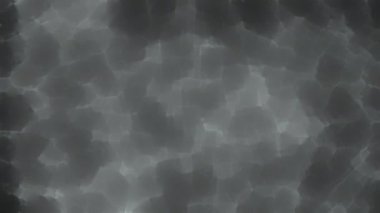 Soyut hareket arkaplanı renkli parçacıklar parlıyor. Kusursuz 4K döngü videosu.