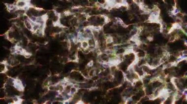 Soyut hareket arkaplanı renkli parçacıklar parlıyor. Kusursuz 4K döngü videosu.