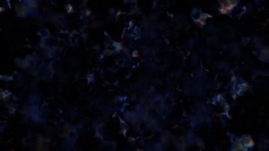 Soyut hareket arkaplanı renkli parçacıklar parlıyor. Kusursuz 4K döngü videosu.