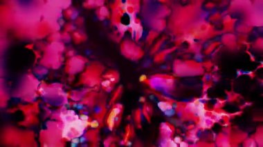 Soyut hareket arkaplanı renkli parçacıklar parlıyor. Kusursuz 4K döngü videosu.