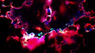 Soyut hareket arkaplanı renkli parçacıklar parlıyor. Kusursuz 4K döngü videosu.