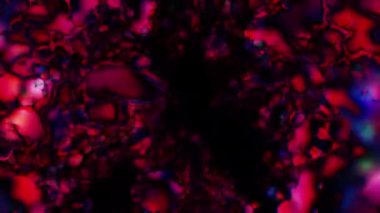 Soyut hareket arkaplanı renkli parçacıklar parlıyor. Kusursuz 4K döngü videosu.