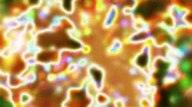 Soyut hareket arkaplanı renkli parçacıklar parlıyor. Kusursuz 4K döngü videosu.