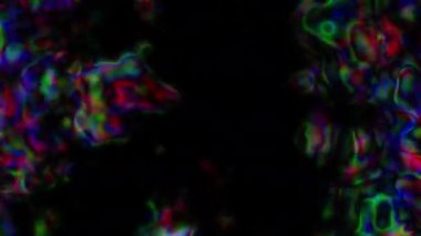 Soyut hareket arkaplanı renkli parçacıklar parlıyor. Kusursuz 4K döngü videosu.