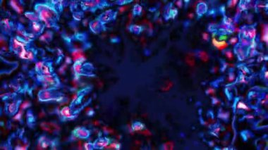 Soyut hareket arkaplanı renkli parçacıklar parlıyor. Kusursuz 4K döngü videosu.