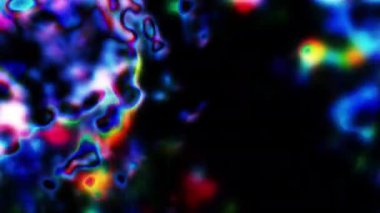 Soyut hareket arkaplanı renkli parçacıklar parlıyor. Kusursuz 4K döngü videosu.