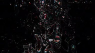 Soyut hareket arkaplanı renkli parçacıklar parlıyor. Kusursuz 4K döngü videosu.