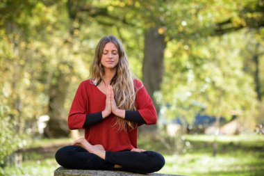 portrait of a yoga coach in nature in autumn season