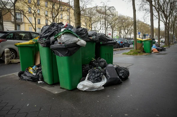 stock image view of bins overflowing with rubbish following the garbage collectors' strike in Paris