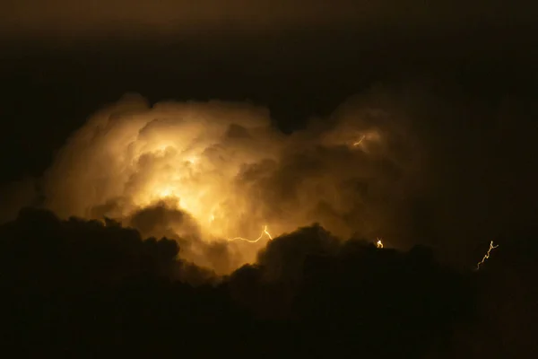 Capture the awe-inspiring power of nature with this stunning image of a lightning bolt piercing through ominous clouds. Perfect for use in advertising, websites, or editorial content.