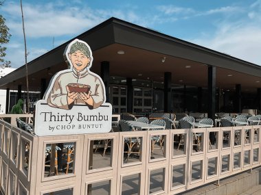 Tangerang, Indonesia - May 13, 2024: Thirty Bumbu by Chop Buntut restaurant logo found at Indonesian Design District (IDD), a hub area for design and furniture enthusiast located in PIK 2 clipart