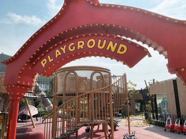 Tangerang, Indonesia - May 13, 2024: Playground area sign in Indonesian Design District (IDD), a hub area for design and furniture enthusiast located in PIK 2. Shot during day time clipart