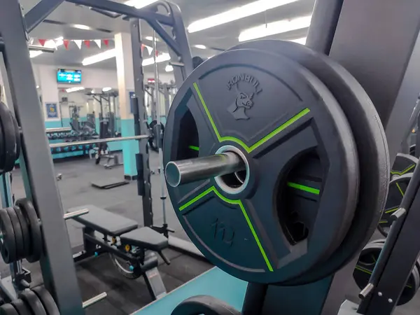 stock image Close-up of Weight Plates on Gym Equipment, Modern Fitness Center Interior, Strength Training Essentials in Professional Gym