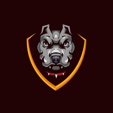 Pitbull Head in Shield Mascot Logo for Sport and Gaming isolated on dark Background