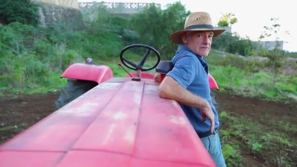 Satisfied Farmer Poses His Tractor Takes His Hat Smiling — Video