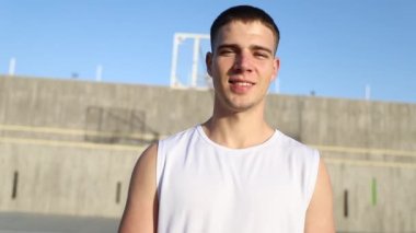 A young attractive basketball player in the basketball court