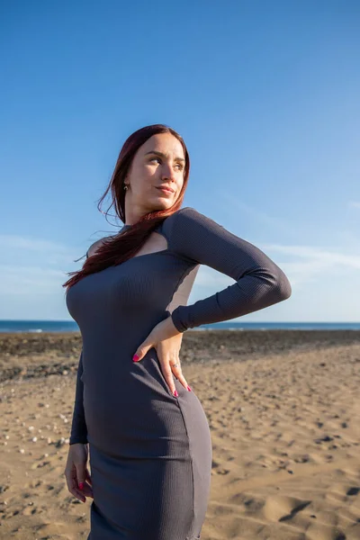 stock image Portrait of a woman at the beach with blank expression looking to the side, vertical shot