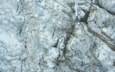 Mermer. Taş zemin. Mineral. Mermer taş dokusu, eşitsizlik, kaya yüzeyi..