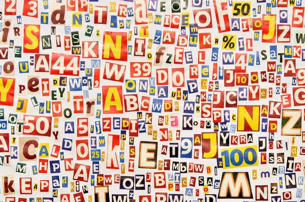 Alphabet pattern of letters and numbers cut from magazines and newspapers