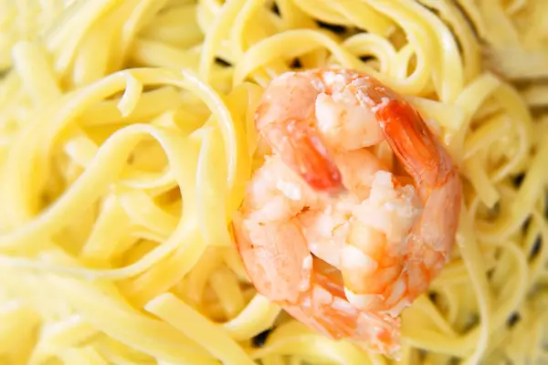 Pasta with shrimp delicious fresh food top view close up