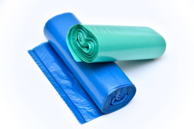 Two roll of garbage bag in heap of green and blue color clipart