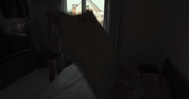 Man Making Bed Morning Wide Angle Video — Vídeo de stock