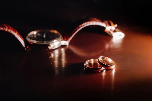 Golden Wedding Rings Wristwatch Background — Photo