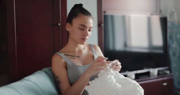 Young Woman Knitting Plaid Home — Video