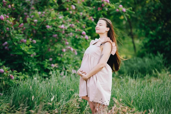 Happy Pregnant Woman Touching Her Belly Standing Nature — Stock Photo, Image