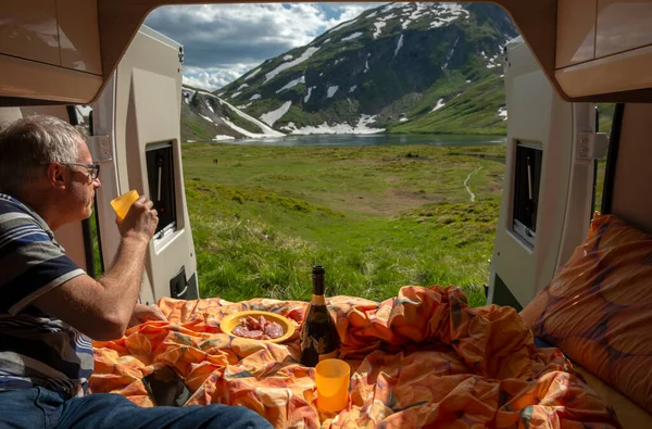 stock image Man is relaxing in his van, Little St. Bernard Pass between France and Italy border