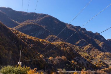 Wires along a beautiful road in the autumn mountains. Ismailly. Azerbaijan. clipart