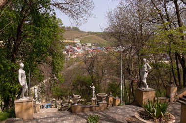 City of Guba. Azerbaijan. 06.28.2023. Staircase with sculptures leading to the river in Nizami Park. clipart