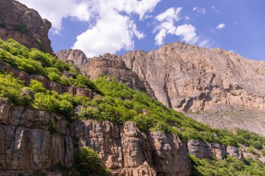 Beautiful green mountains against the blue sky. Gubinsky district. Azerbaijan.