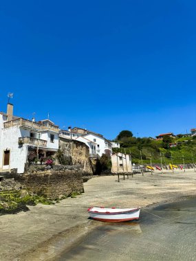 Waterfront houses boat. Small galician village. High quality photo clipart