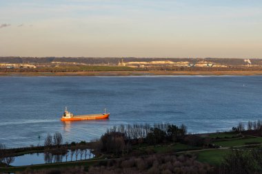 Merchant ship sailing in the Seine estuary from the heights of Honfleur