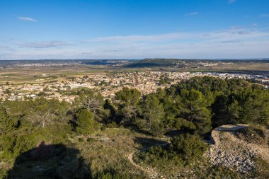View of the small town of Calvisson, in the Vaunage plain, from the Roc de Gachone
