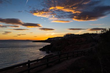 Glowing sky at sunset over the Crique de l'Anau and the Mediterranean Sea in Sete