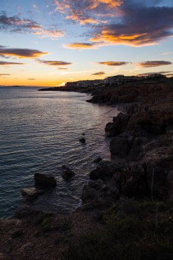 Glowing sky at sunset over the Crique de l'Anau and the Mediterranean Sea in Sete