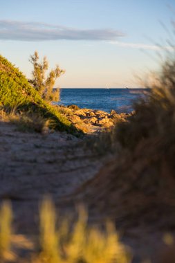 Path to Turtle Cove and the Mediterranean Sea at sunset