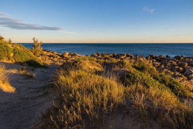 Path to Turtle Cove and the Mediterranean Sea at sunset