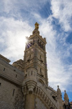 Sunbeams on the bell tower of the Basilica of Notre-Dame de la Garde in Marseille