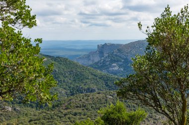View on the outside of the Cirque de l'Infernet and the plain of Languedoc from the slopes of Mont Saint-Baudille