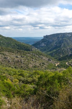 View on the outside of the Cirque de l'Infernet and the plain of Languedoc from the slopes of Mont Saint-Baudille